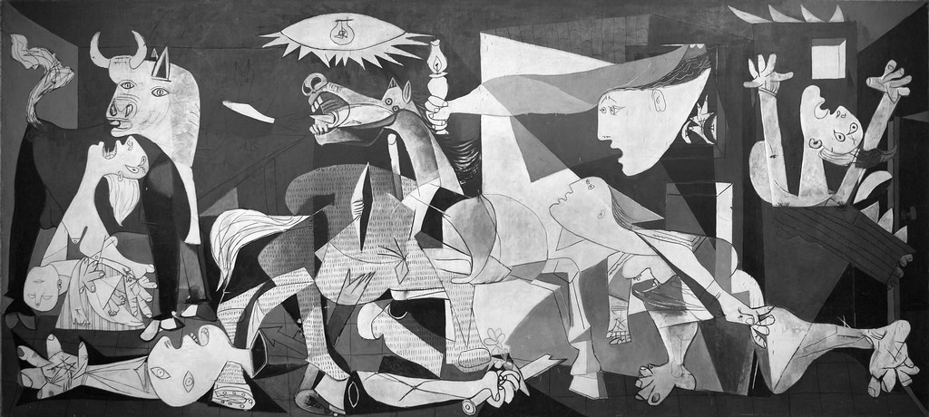 Picasso's Guernica. A distressing artwork of multiple abstract shapes and discordant human bodies n black and white.